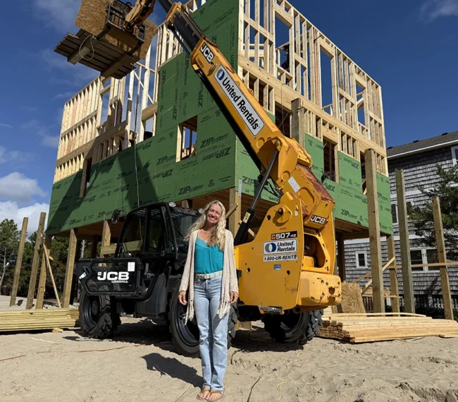 Kara Bolton on-site during the early stages of construction for her Outer Banks home.