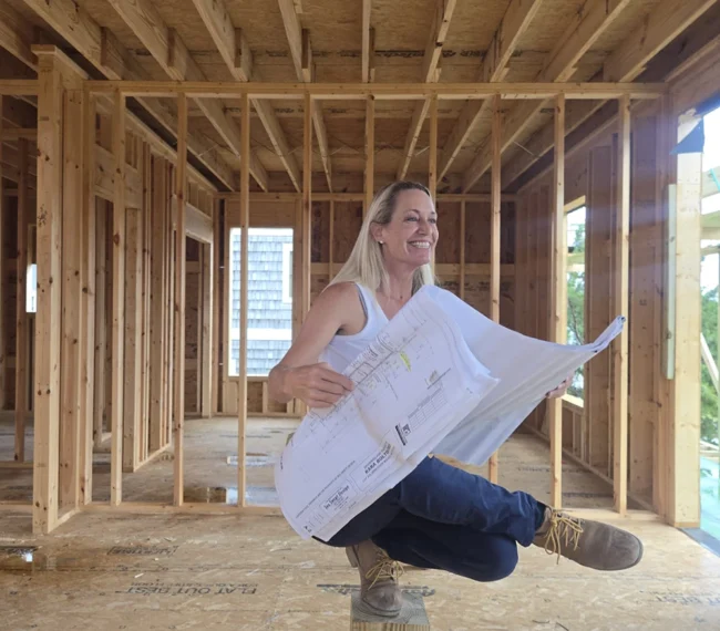 Kara Bolton reviewing construction plans on her residential project in the Outer Banks
